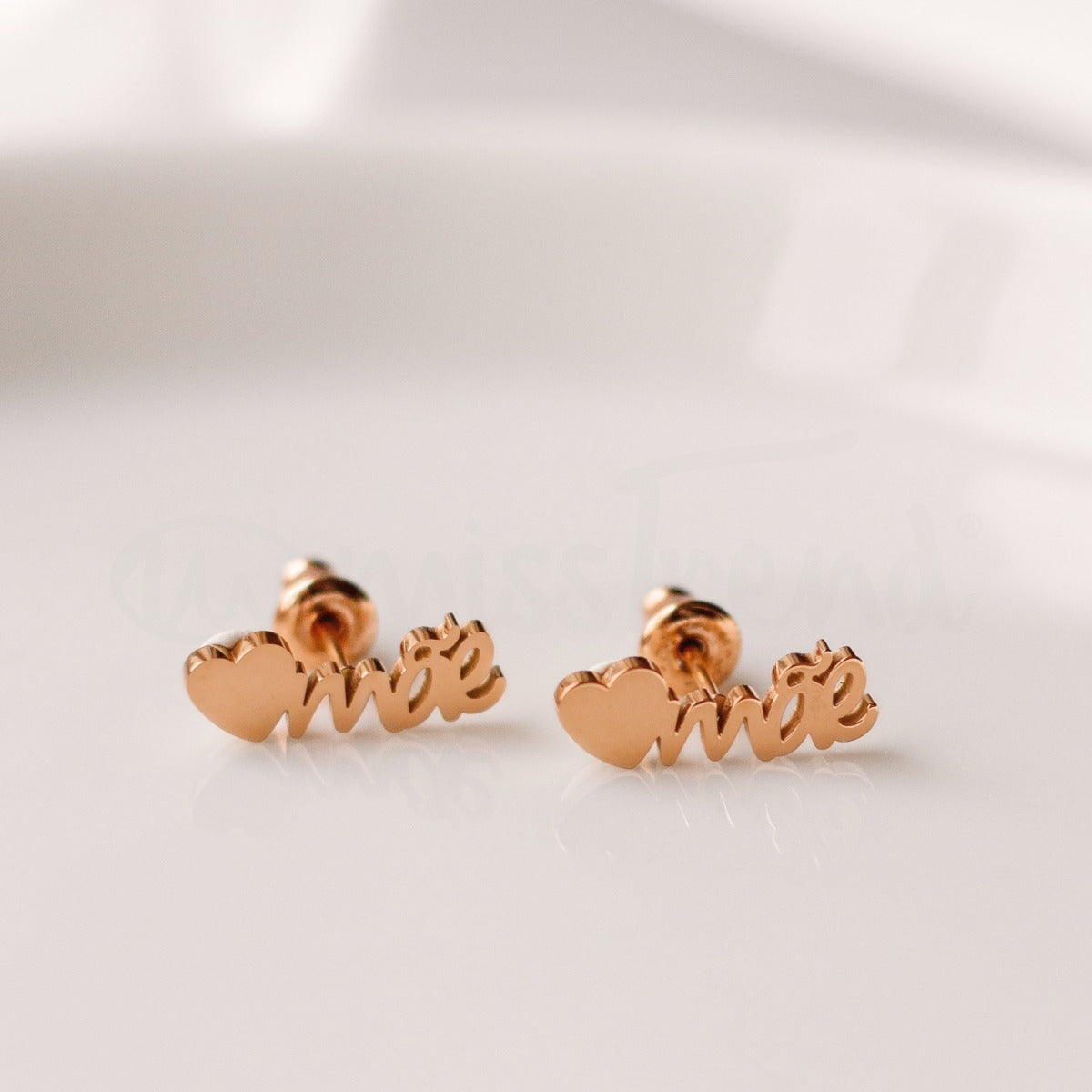 Brincos mãe Coraçon em aço dourado
